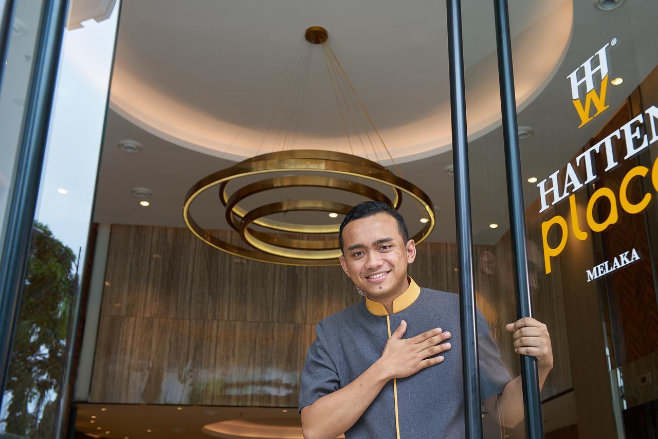 Hatten Place Melaka Екстериор снимка A doorman at the entrance of a hotel in Malaysia.